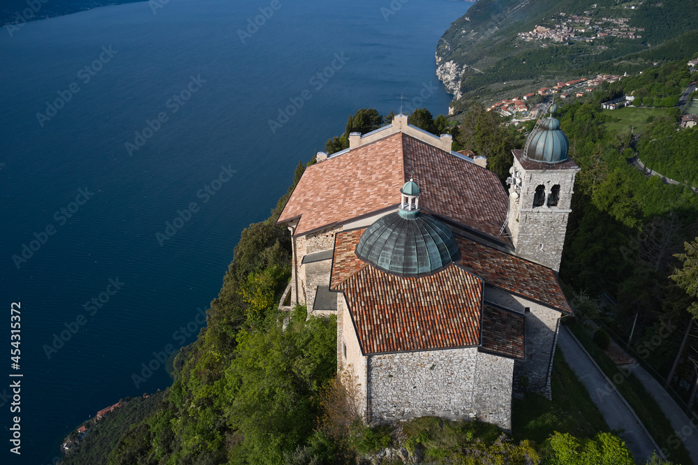 Aerial view of the church on the mountain. Top view of the Eremo di Montecastello church. Aerial panorama of Montecastello. Catholic Church Eremo di Montecastello. Lake Garda, Italy.