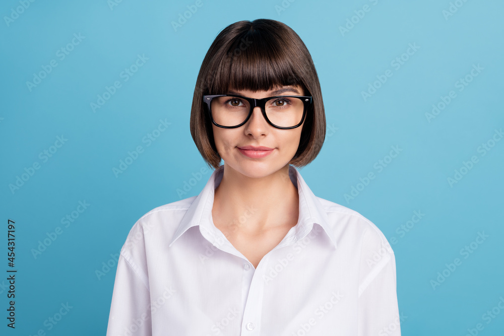 Portrait of attractive cheery intellectual girl ceo boss chief top director isolated over bright blue color background