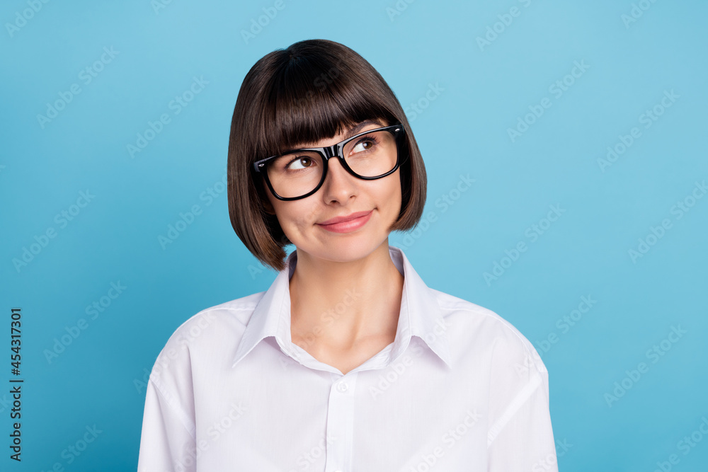 Portrait of attractive cheerful pensive girl specialist creating solution dilemma isolated over bright blue color background