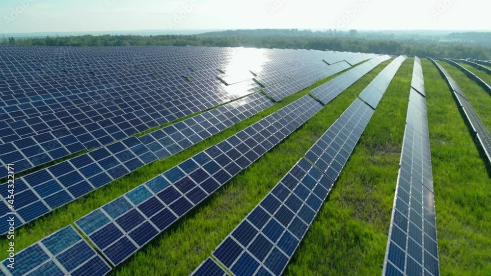 Top view of solar farm with hundreds panels on field