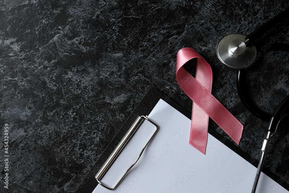 Breast cancer awareness concept on black smokey table Breast cancer awareness concept on black smokey table
