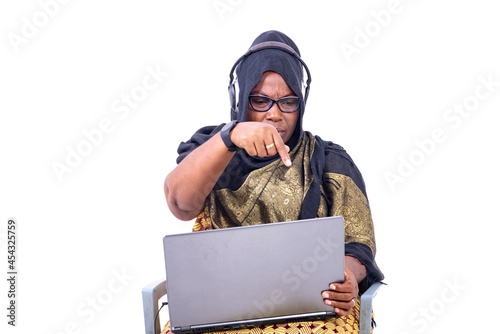 portrait of a beautiful muslim businesswoman with laptop and headset, unhappy.