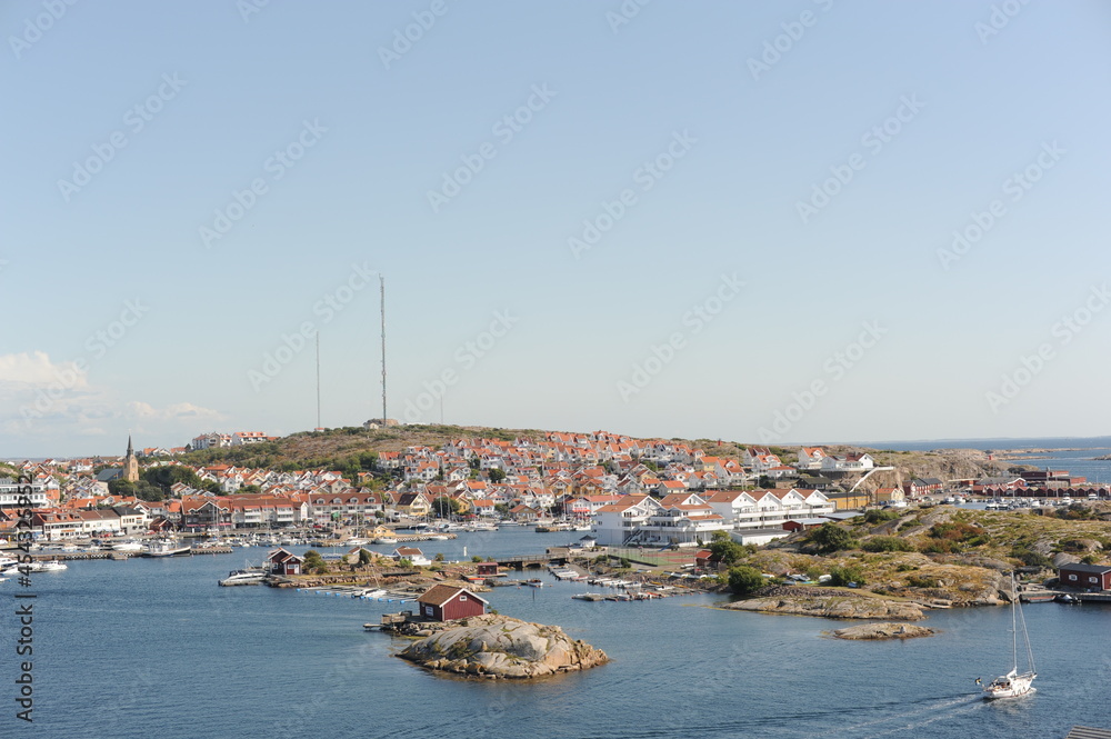 Scenic panorama of Kungshamn waterfront (Sotenäs, Västra Götaland, Sweden) with boats, yachts and houses on a sunny day in summer