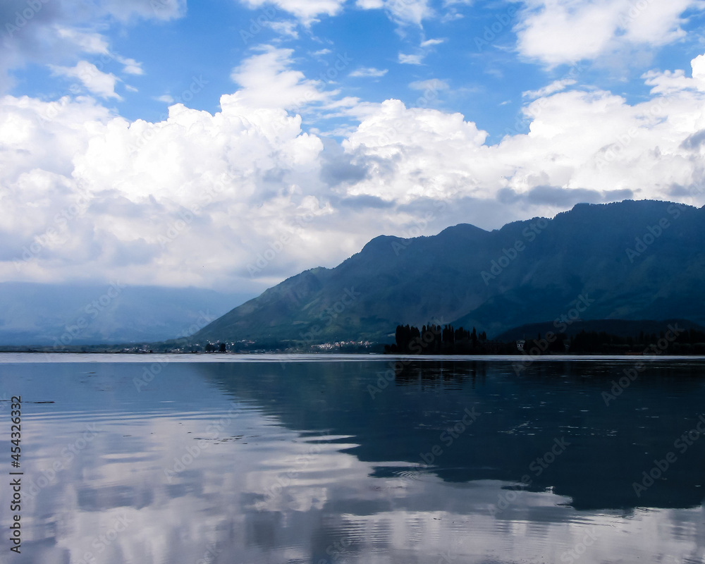 Reflections of  Zabarwan Hills and clouds on Dal Lake,Kashmir,India 