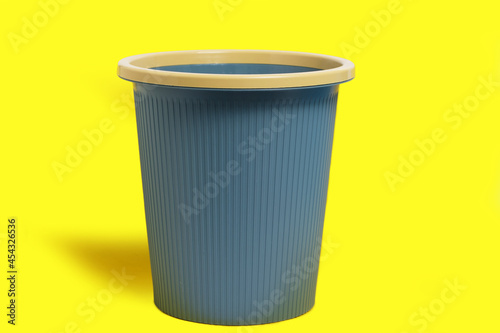 Wallpaper Mural Dark blue garbage bucket on a yellow background. Torontodigital.ca