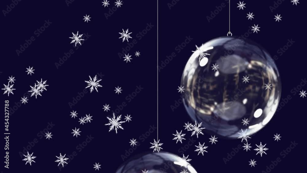 Animation of snow falling over glass christmas baubles on black background Animation of snow falling over glass christmas baubles on black background
