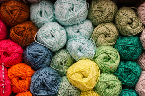 Фотография Colorful background of many yarn for handmade knitting