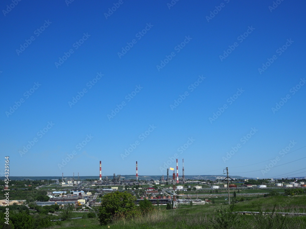 Oil refinery and petrochemical architecture plant industrial with blue sky background, White oil and gas refinery tank, Oil refinery plant from industry zone business power and energy petroleum.