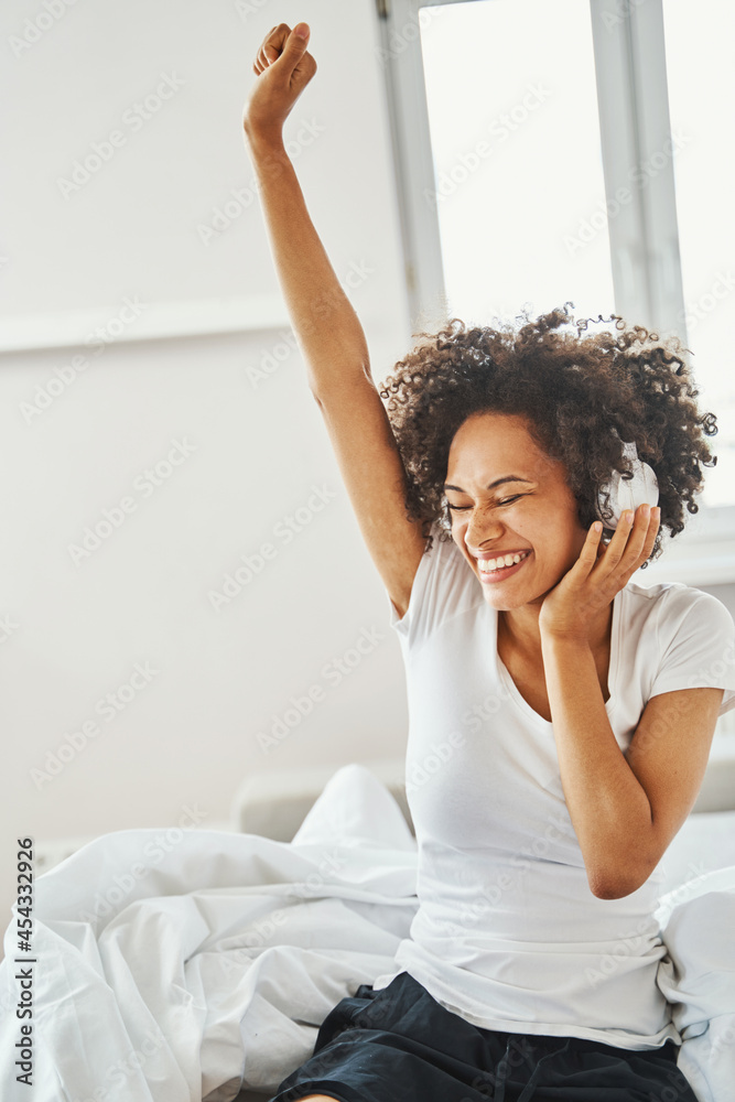 Cute dark-haired female enjoying her favorite music Cute dark-haired female enjoying her favorite music