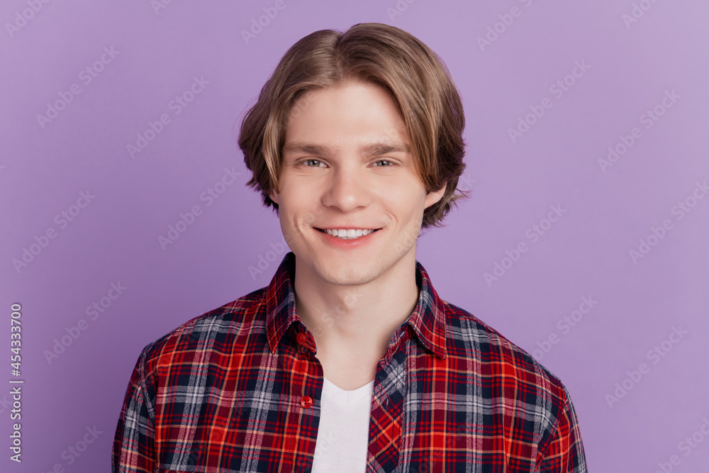 Portrait of cheerful charming positive guy toothy beaming smile posing on violet background Portrait of cheerful charming positive guy toothy beaming smile posing on violet background