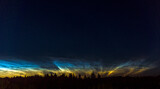 Silver clouds. Noctilucent clouds are highest clouds in the Earth's atmosphere visible in a deep twilight. 