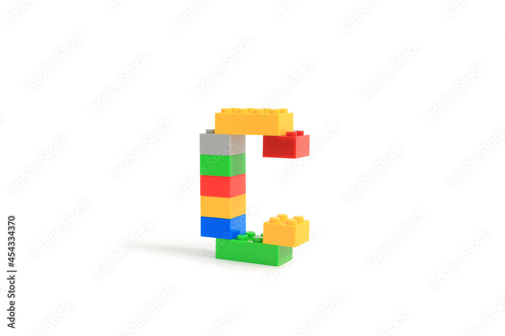 Obraz premium Alphabet letters C from colorful plastic brick block constructor isolated on white background. Image with Clipping path