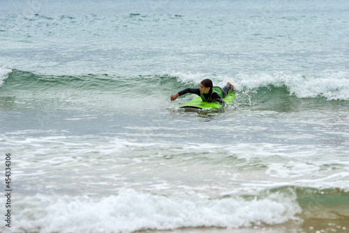 cute young girl learning to surf © Image'in
