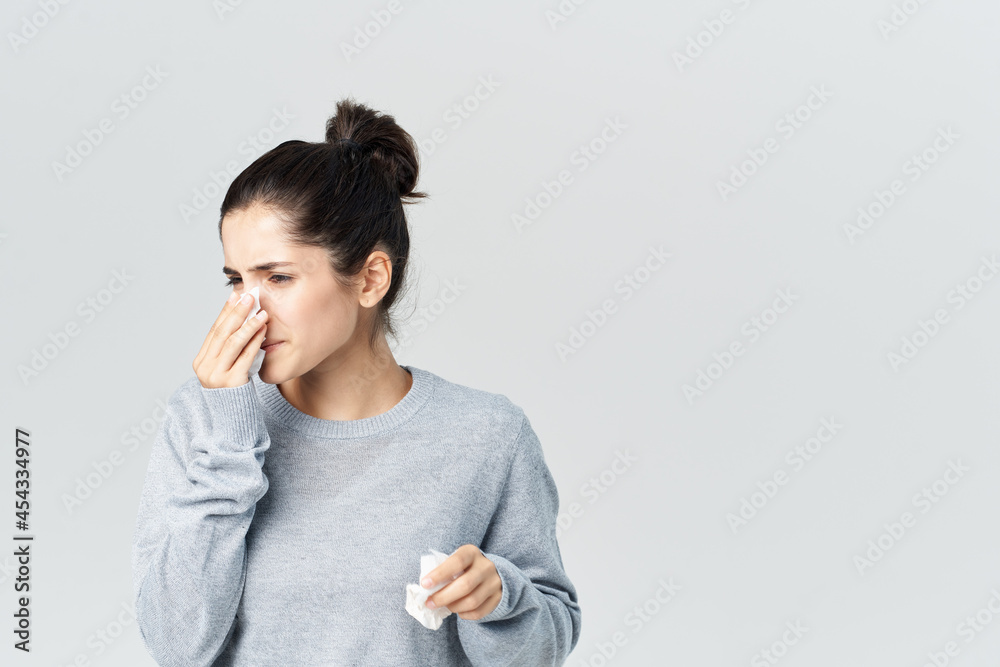 sick woman wiping face with handkerchief cold isolated background sick woman wiping face with handkerchief cold isolated background