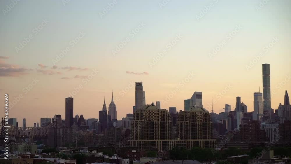 Sunset in city, silhouette of house skyscrapers. Cityscape of New York Manhattan Sunset in city, silhouette of house skyscrapers. Cityscape of New York Manhattan