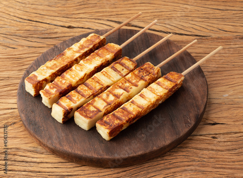 Grilled Rennet or Coalho cheese on a wooden board