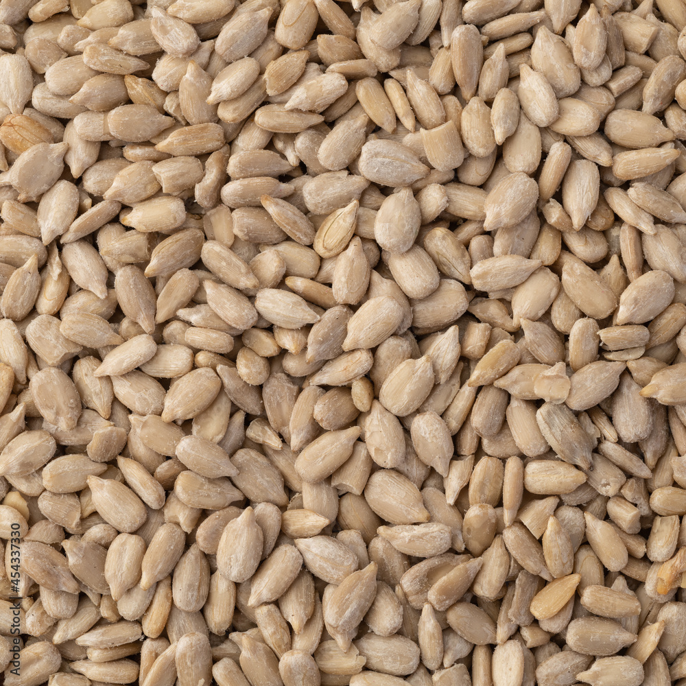 Closeup top view of sunflower seeds. Food backdrop