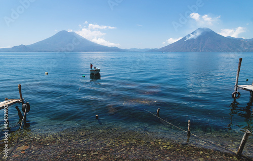 Tranquil view on lake Atitlan with view on volcano peaks in Santa Cruz la Laguna, Guatemala