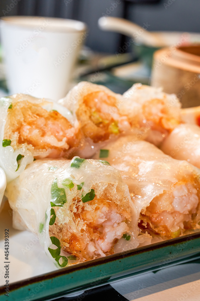 A plate of delicious Cantonese morning tea dim sum crispy shrimp rice rolls A plate of delicious Cantonese morning tea dim sum crispy shrimp rice rolls
