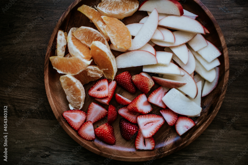 Overhead view of sliced fresh fruit on a plate Overhead view of sliced fresh fruit on a plate