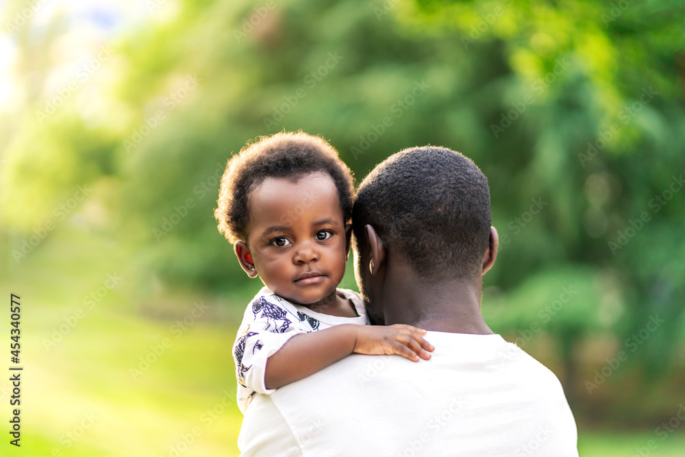 beautiful African girl hugging her father beautiful African girl hugging her father