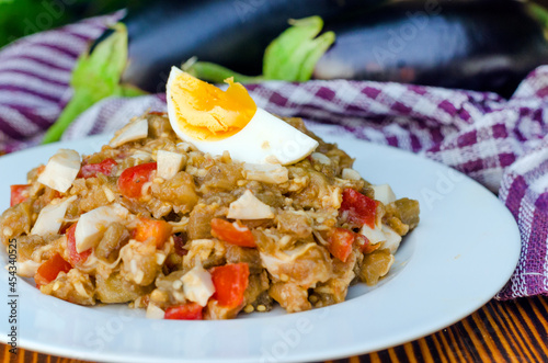 Fried eggplant salad with tomato and egg