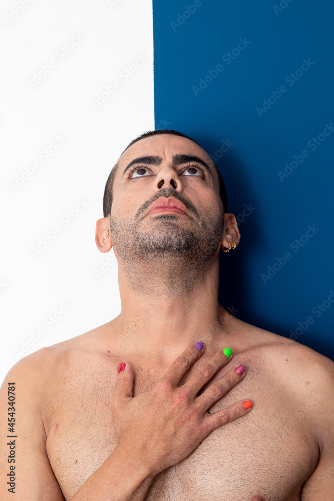 Obraz premium gay man rainbow colored nails, no shirt