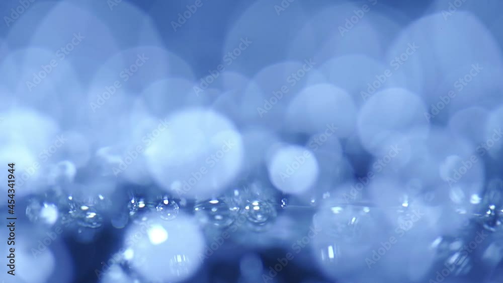 close-up Water bubbling or boiling in clear glass. on a black background. close-up Water bubbling or boiling in clear glass. on a black background.