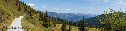 a panorama with a path leading through the beautiful alpine landscape in the Schladming-Dachstein region in Austria 