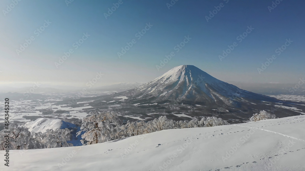 Mount Fuji in Japan in winter. A volcano covered with snow. Snow mountain from afar