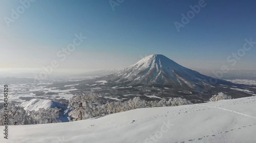 Mount Fuji in Japan in winter. A volcano covered with snow. Snow mountain from afar © OleJohny