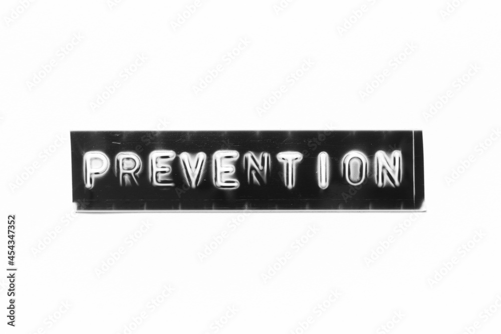 Embossed letter with word prevention in black banner on white paper background Embossed letter with word prevention in black banner on white paper background
