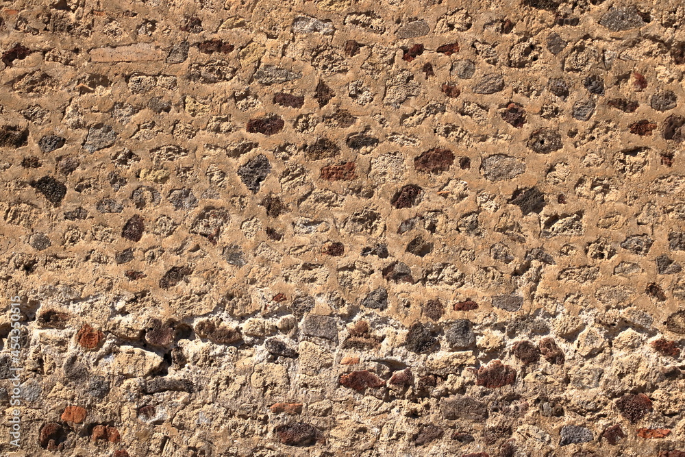Old medieval wall made from yellow stone Old medieval wall made from yellow stone