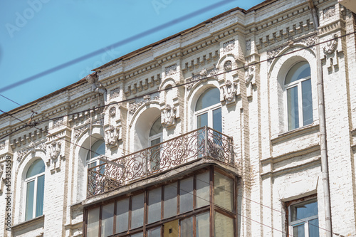 facade of a building with a balcony © Евгения Смульская