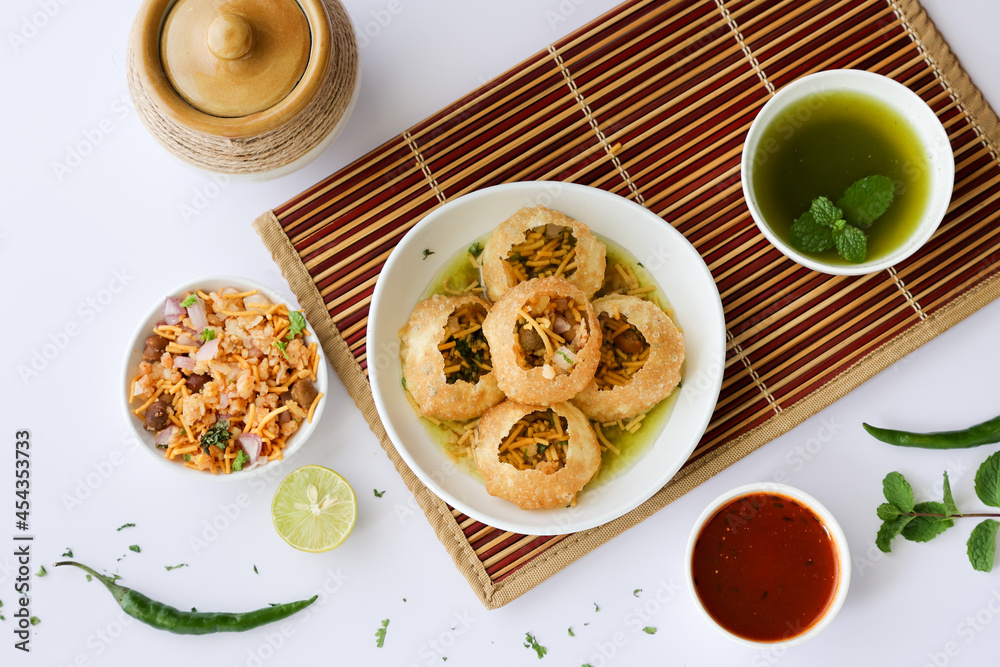 Girl women taking spicy Pani puri golgappe with hand, Chat item, India. North Indian street food Indian panipuri snack eaten tangy tamarind water, potato stuffing Delhi, Mumbai, Holi Diwali Dussehra Girl women taking spicy Pani puri golgappe with hand, Chat item, India. North Indian street food Indian panipuri snack eaten tangy tamarind water, potato stuffing Delhi, Mumbai, Holi Diwali Dussehra