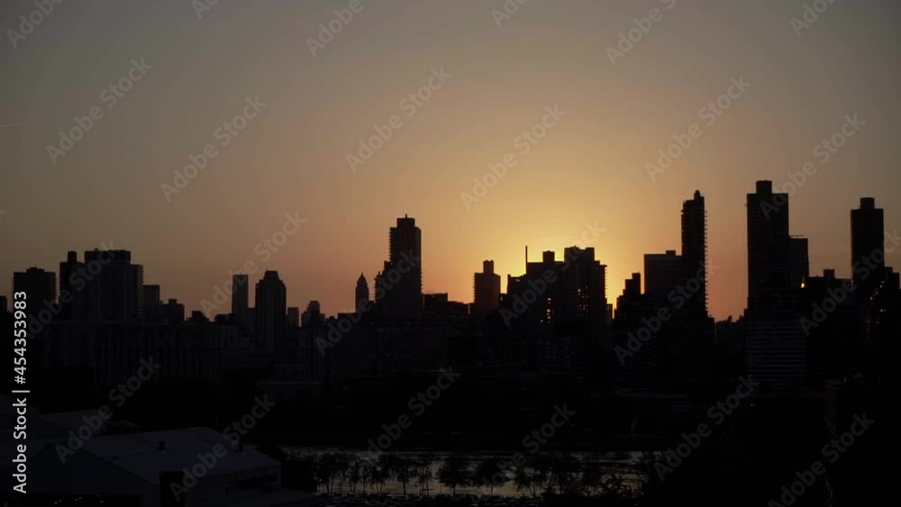 Sunset in city, silhouette of house skyscrapers. Cityscape of New York Manhattan Sunset in city, silhouette of house skyscrapers. Cityscape of New York Manhattan