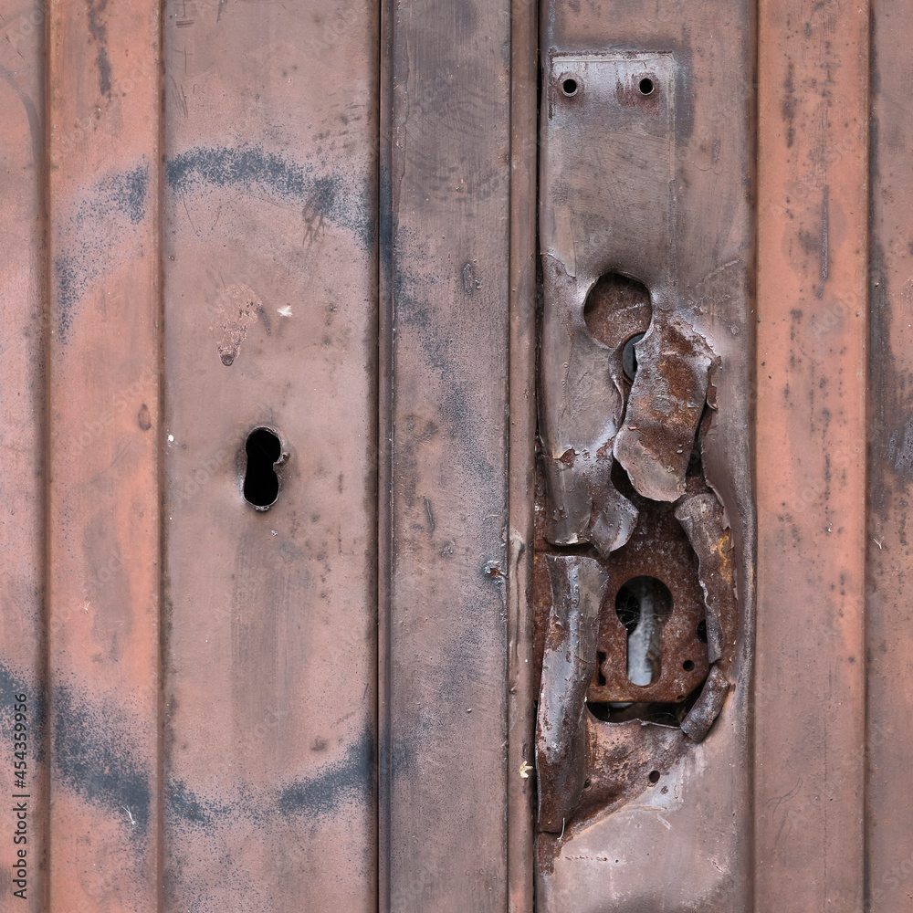 Old damaged metal rusty door