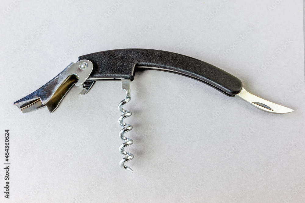 Multifunctional pocket opener on a gray background Multifunctional pocket opener on a gray background