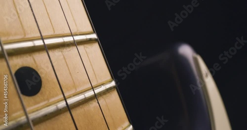 Electric Guitar Fretboard Close Up Pan Left photo