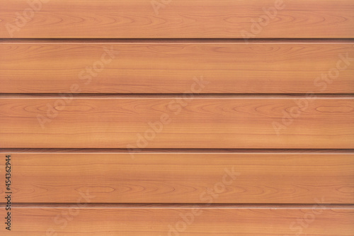 Brown horizontal wooden texture of the facade of the house and interior wood natural background