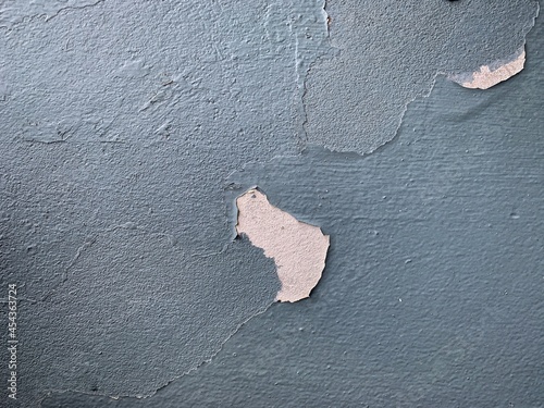 Peeling paint on a cement wall photo