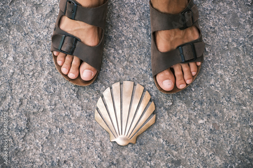 legs of a pilgrim on sandals
