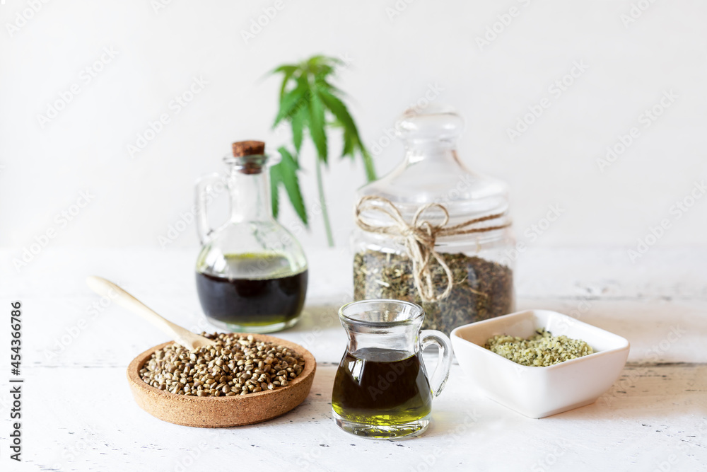 Hemp products: oil, tea, seeds shelled and whole, yogurt with seeds, cannabis plant Hemp products: oil, tea, seeds shelled and whole, yogurt with seeds, cannabis plant