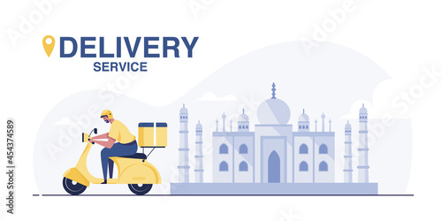 Scooter Delivery Service. Young Indian delivery man with parcel riding a motorcycle.