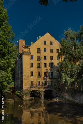 Old color big house mill in Litomerice town in north Bohemia in summer evening
