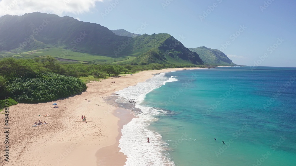 Aerial view from above down Drone shot. Beautiful tropical beach sea with white sand. Top view. Empty and clean beach in summer season on Oahu Hawaii Island.