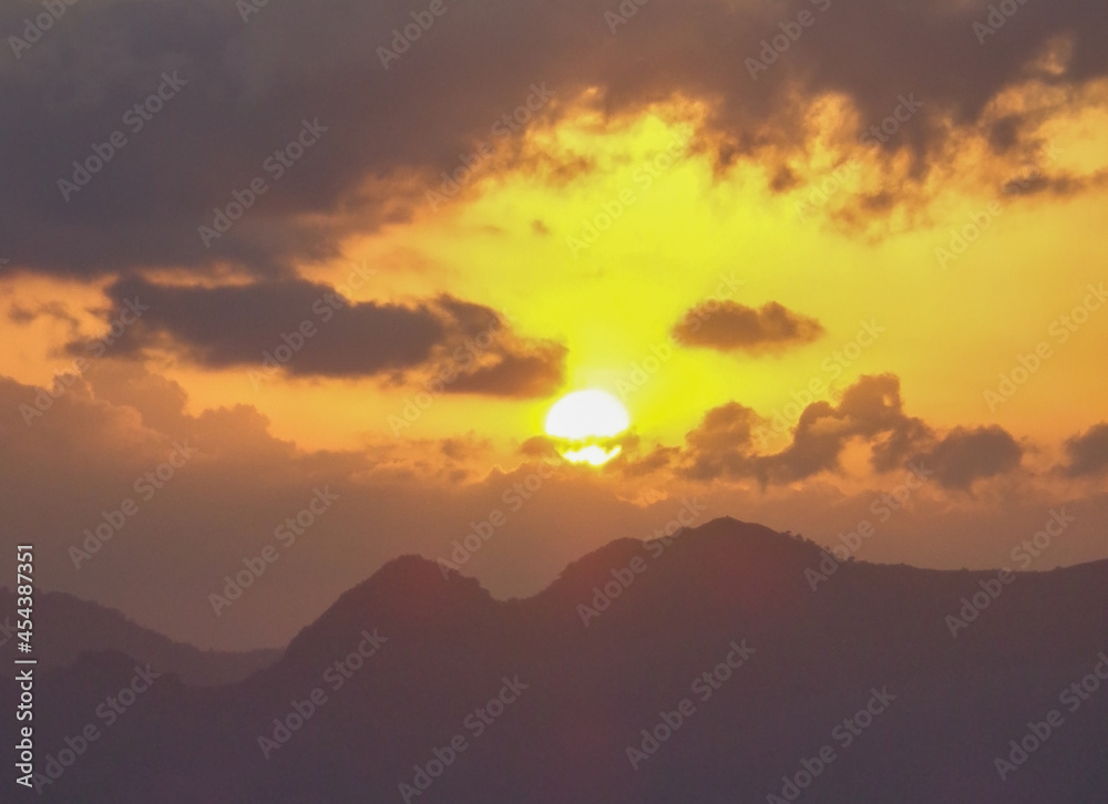 Sunrise or sunset behind the mountain
