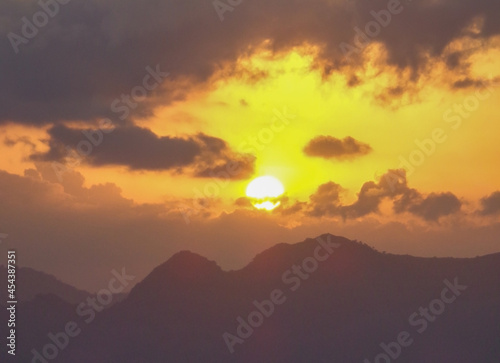 Sunrise or sunset behind the mountain