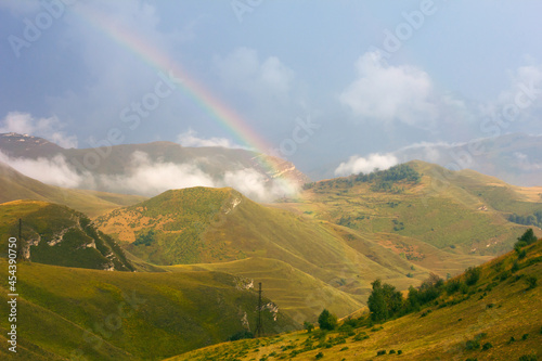 Beautiful mountain landscape with a rainbow. Mountains of the Republic of Dagestan, Russia