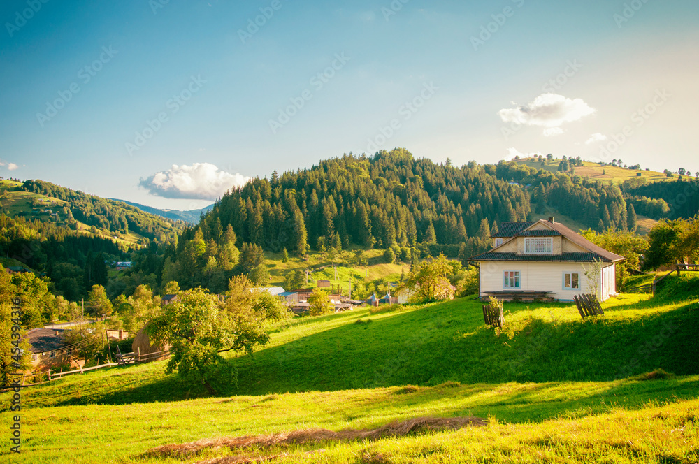 the beginning of autumn on the slopes of the Carpathian Mountains, a house in the mountains, travel. High quality photo